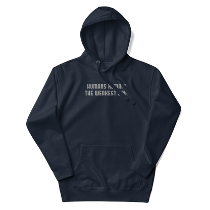 "Humans remain the weakest link" printed on a navy blazer unisex hoodie laying on a flat surface with the hood up