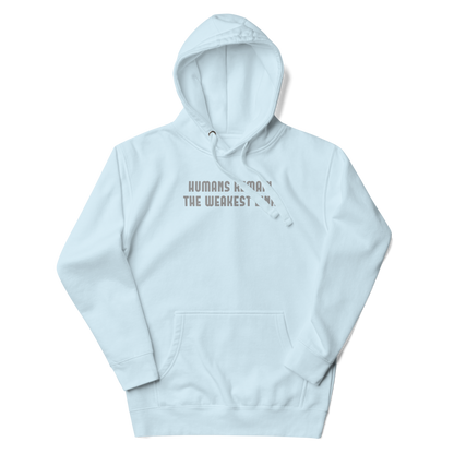 "Humans remain the weakest link" printed on a sky blue unisex hoodie laying on a flat surface with the hood up