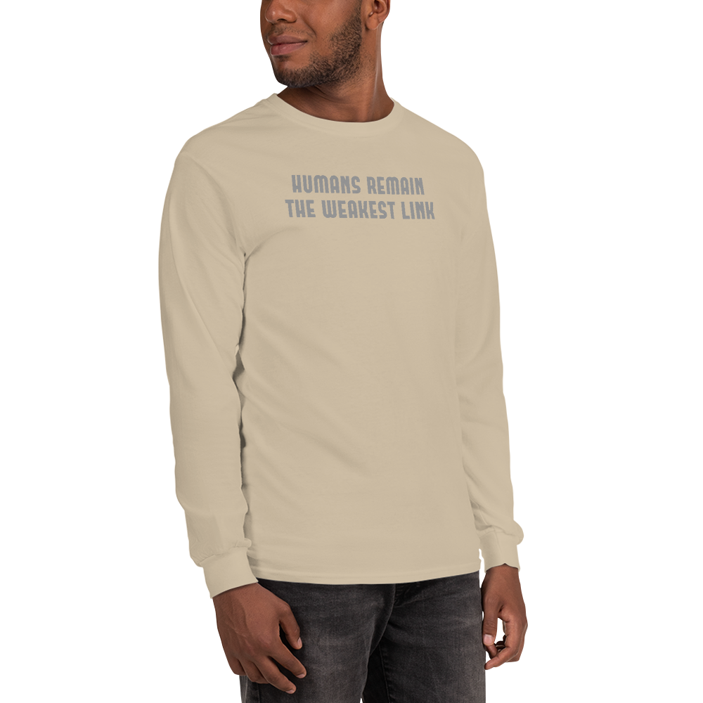 "Humans remain the weakest link" printed on a sand men's long sleeve shirt worn by a male