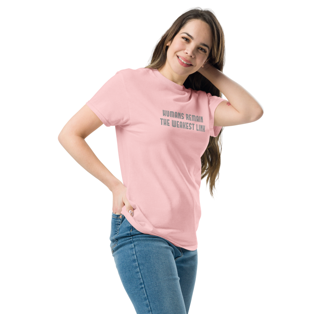 "Humans remain the weakest link" printed on a light pink unisex classic tee worn by a female