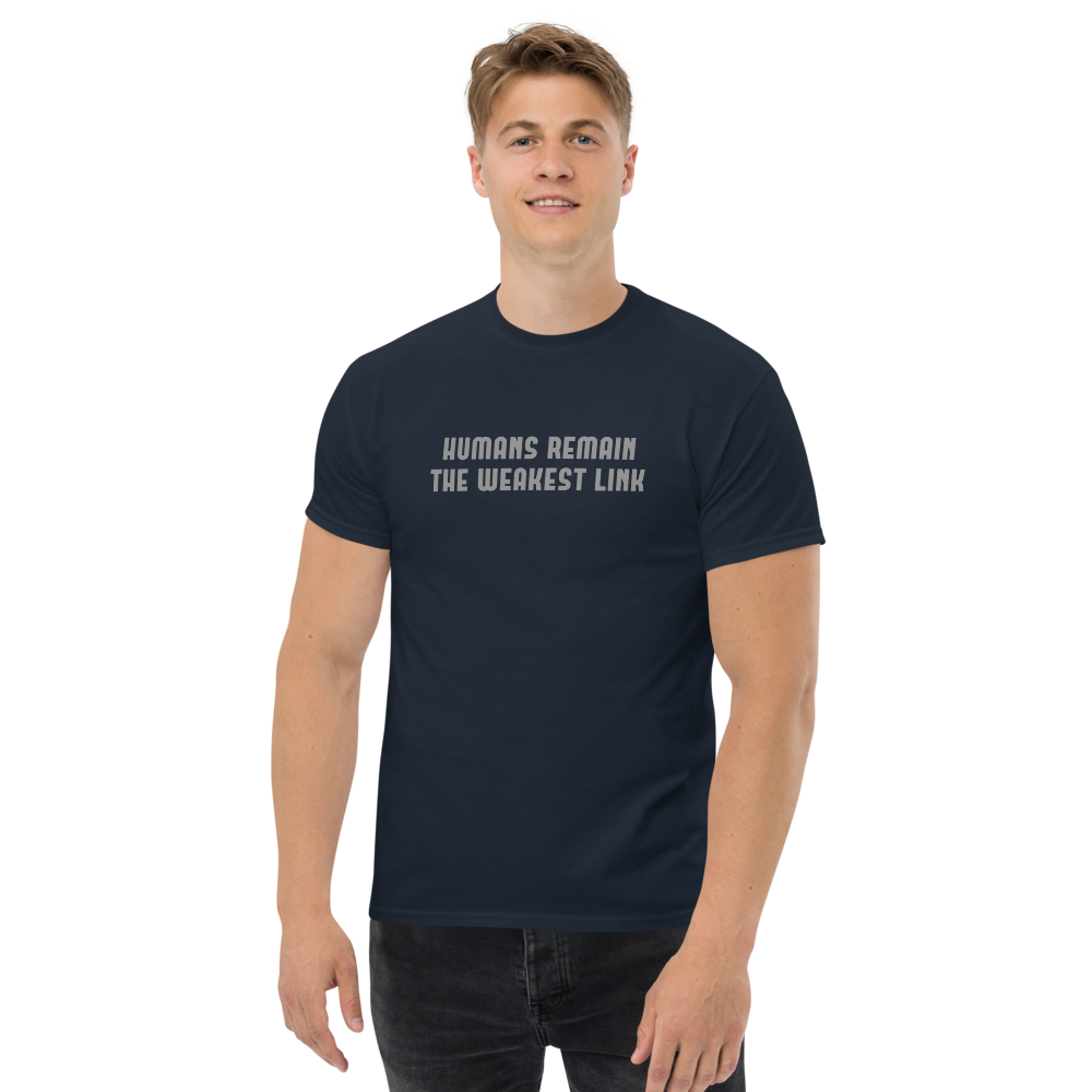 "Humans remain the weakest link" printed on a navy unisex classic tee worn by a male