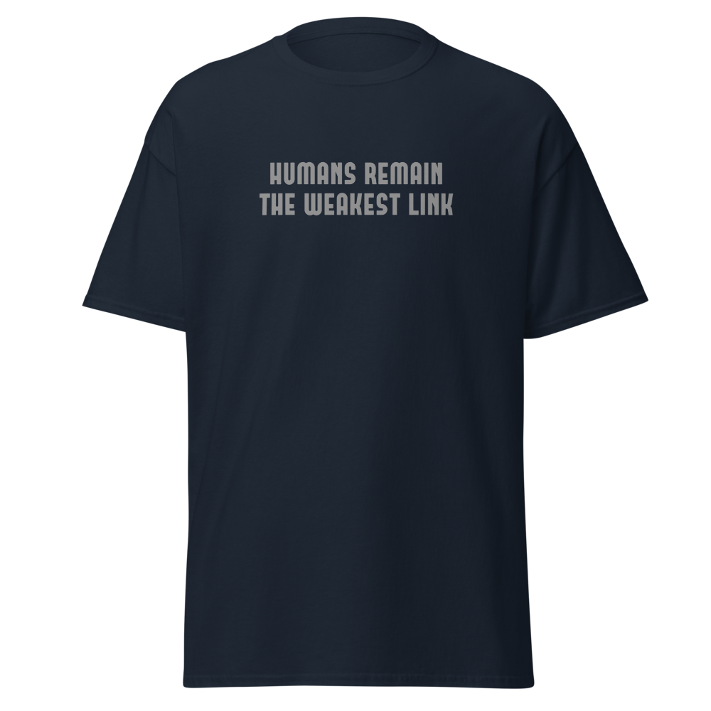 "Humans remain the weakest link" printed on a navy unisex classic tee laying on a flat surface