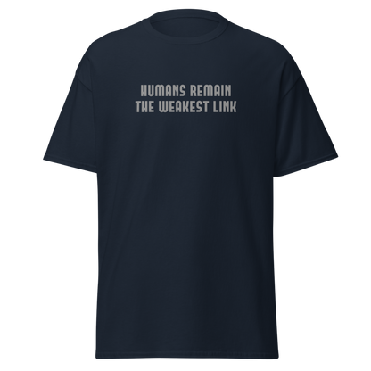 "Humans remain the weakest link" printed on a navy unisex classic tee laying on a flat surface
