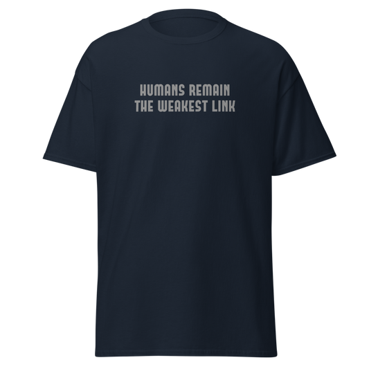 "Humans remain the weakest link" printed on a navy unisex classic tee laying on a flat surface