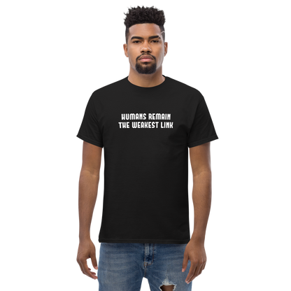 "Humans remain the weakest link" printed on a black unisex classic tee worn by a male