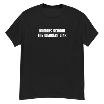 "Humans remain the weakest link" printed on a black unisex classic tee laying on a flat surface