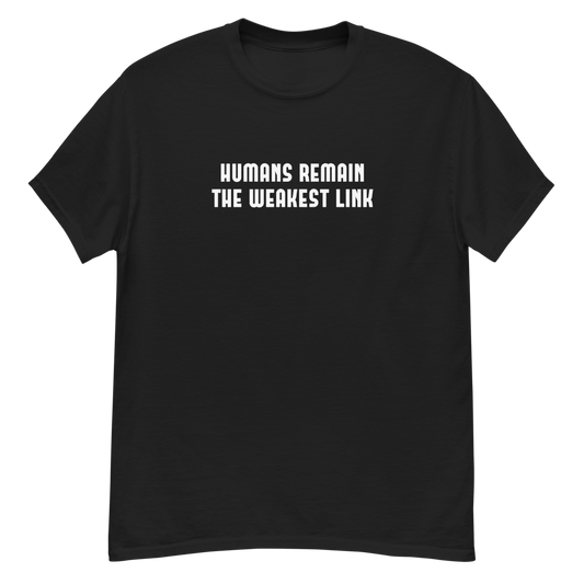 "Humans remain the weakest link" printed on a black unisex classic tee laying on a flat surface