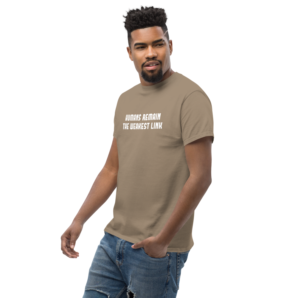 "Humans remain the weakest link" printed on a brown savana unisex classic tee worn by a male