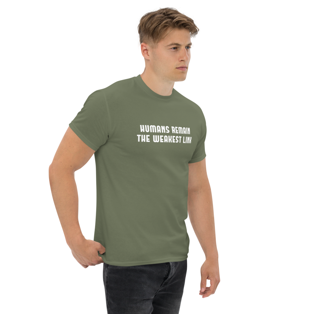 "Humans remain the weakest link" printed on a military green unisex classic tee worn by a male
