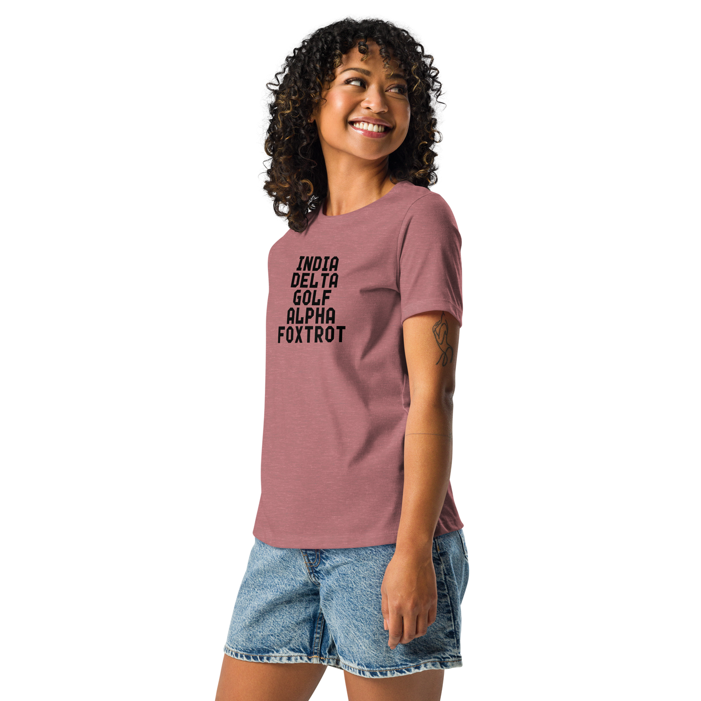 "India Delta Golf Alpha Foxtrot" printed on a heather mauve women's relaxed t-shirt worn by a female