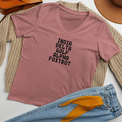"India Delta Golf Alpha Foxtrot" printed on a heather mauve women's relaxed v-neck t-shirt laying on a flat surface amongst other clothes