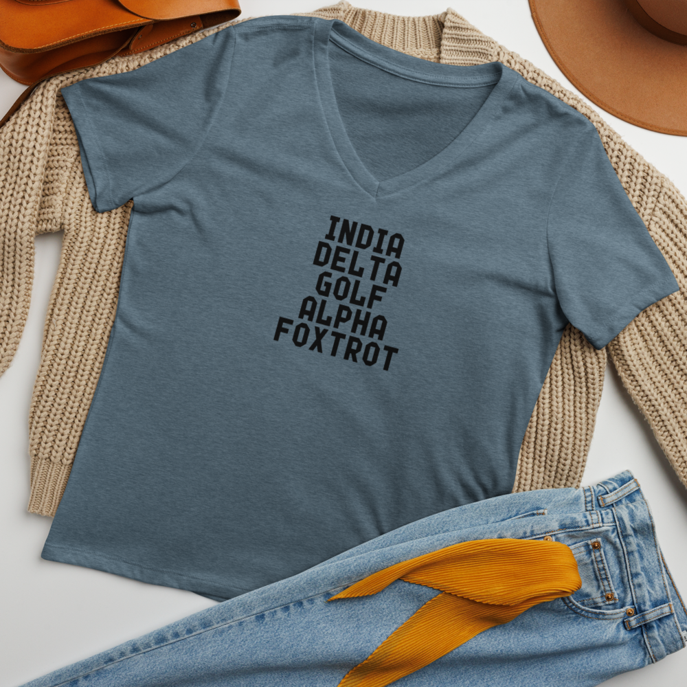 "India Delta Golf Alpha Foxtrot" printed on a heather slate women's relaxed v-neck t-shirt laying on a flat surface amongst other clothes