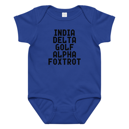 "India Delta Golf Alpha Foxtrot" printed on a royal baby jersey bodysuit laying on a flat surface amongst other clothes
