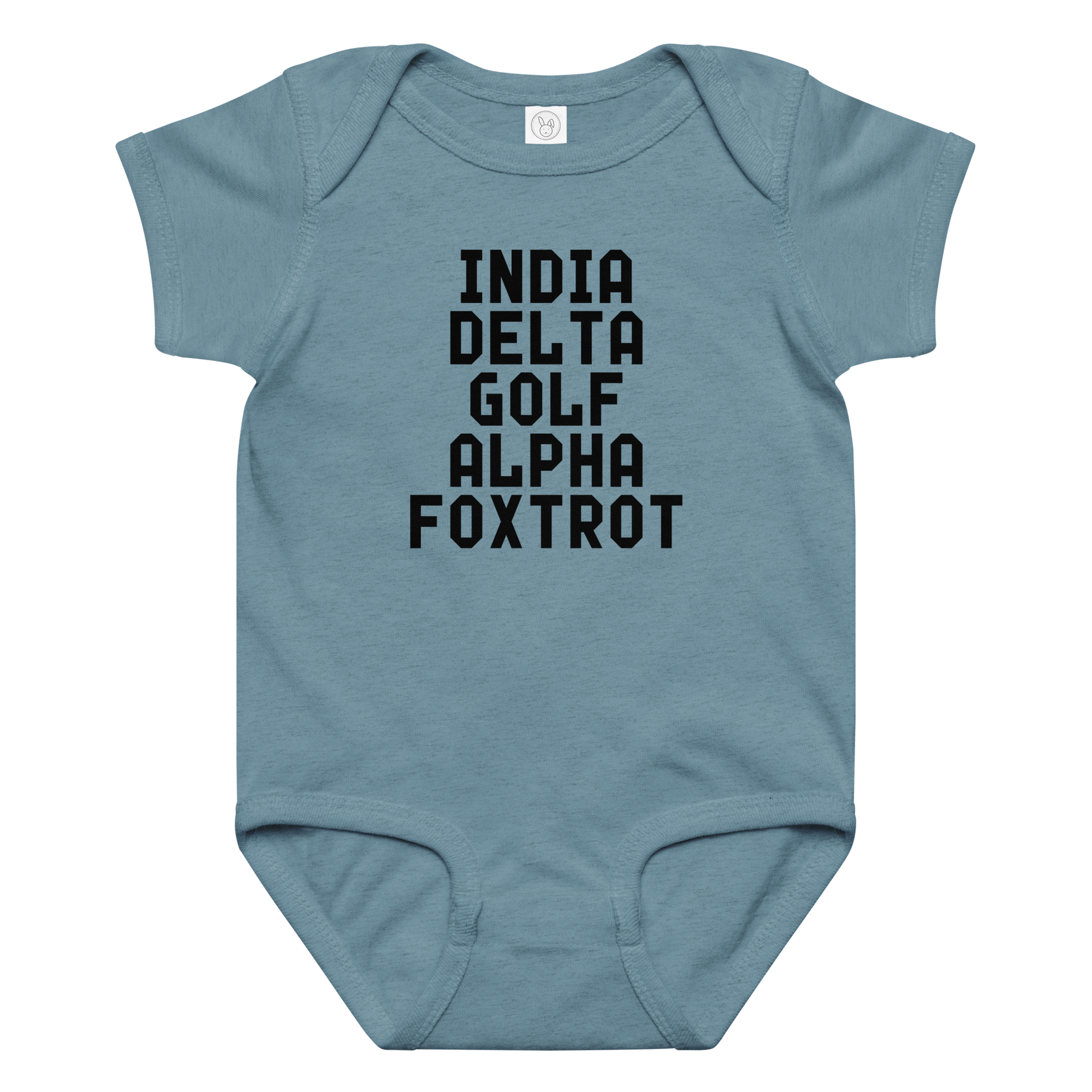 "India Delta Golf Alpha Foxtrot" printed on a vintage indigo baby jersey bodysuit laying on a flat surface amongst other clothes