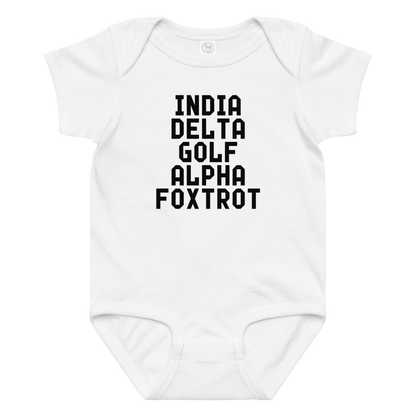 "India Delta Golf Alpha Foxtrot" printed on a white baby jersey bodysuit laying on a flat surface amongst other clothes