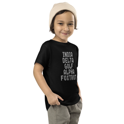 "India Delta Golf Alpha Foxtrot" printed on a black toddler short sleeve tee worn by a male who is also wearing a knit cap