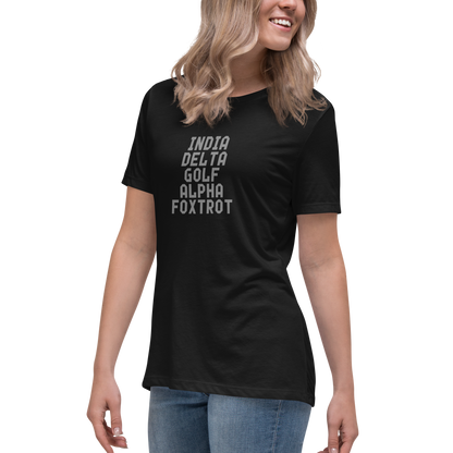 "India Delta Golf Alpha Foxtrot" printed on a black women's relaxed t-shirt worn by a female