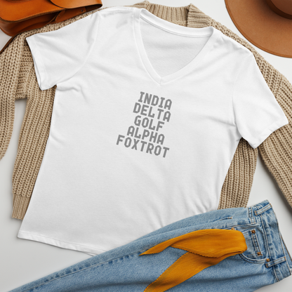 "India Delta Golf Alpha Foxtrot" printed on a solid white blend women's relaxed v-neck t-shirt laying on a flat surface amongst other clothes