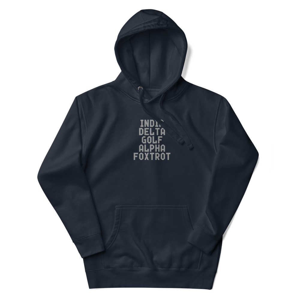 "India Delta Golf Alpha Foxtrot" printed on a navy blazer unisex hoodie laying on a flat surface with the hood up