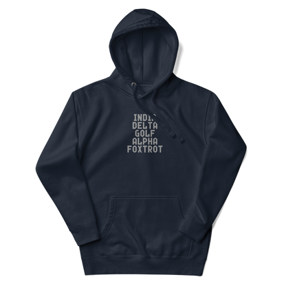 "India Delta Golf Alpha Foxtrot" printed on a navy blazer unisex hoodie laying on a flat surface with the hood up