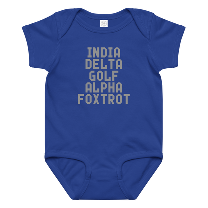 "India Delta Golf Alpha Foxtrot" printed on a royal baby jersey bodysuit laying on a flat surface amongst other clothes