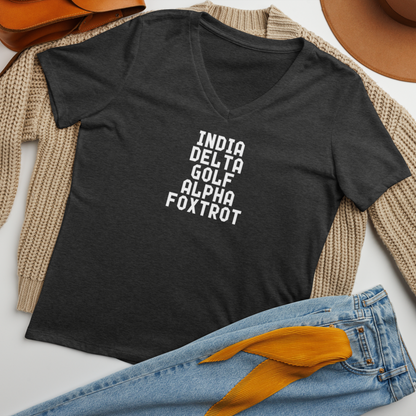 "India Delta Golf Alpha Foxtrot" printed on a dark grey heather women's relaxed v-neck t-shirt laying on a flat surface amongst other clothes