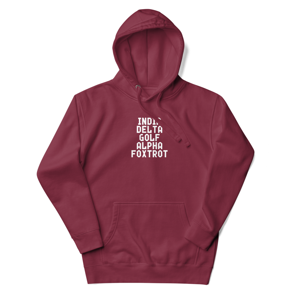 "India Delta Golf Alpha Foxtrot" printed on a maroon unisex hoodie laying on a flat surface with the hood up