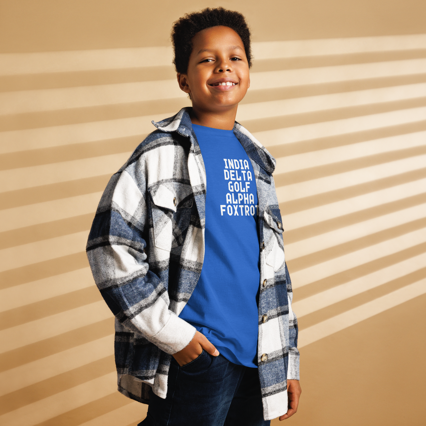 "India Delta Golf Alpha Foxtrot" printed on a royal youth classic tee worn by a male also wearing a jacket