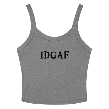 "IDGAF" printed on a athletic heather women's micro-rib tanktop laying on a flat surface amongst sunglasses and shorts