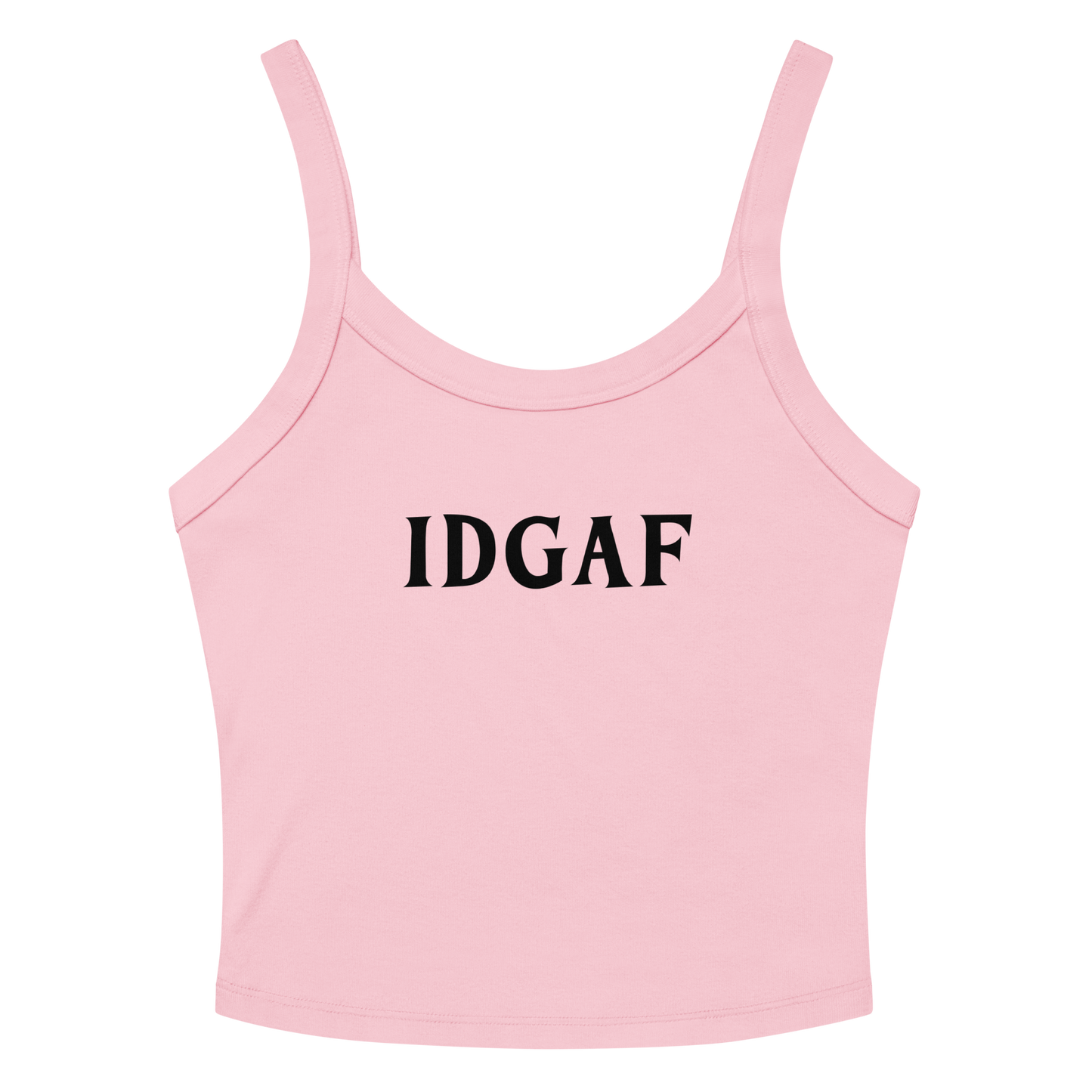 "IDGAF" printed on a solid pink blend women's micro-rib tanktop laying on a flat surface amongst sunglasses and shorts