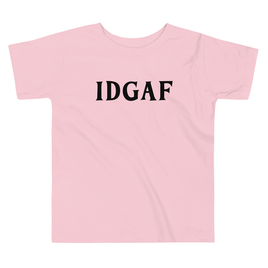 "IDGAF" printed on a pink toddler short sleeve tee laying on a flat surface