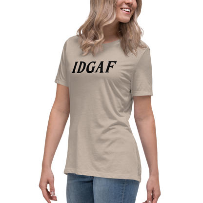 "IDGAF" printed on a heather stone women's relaxed t-shirt worn by a female
