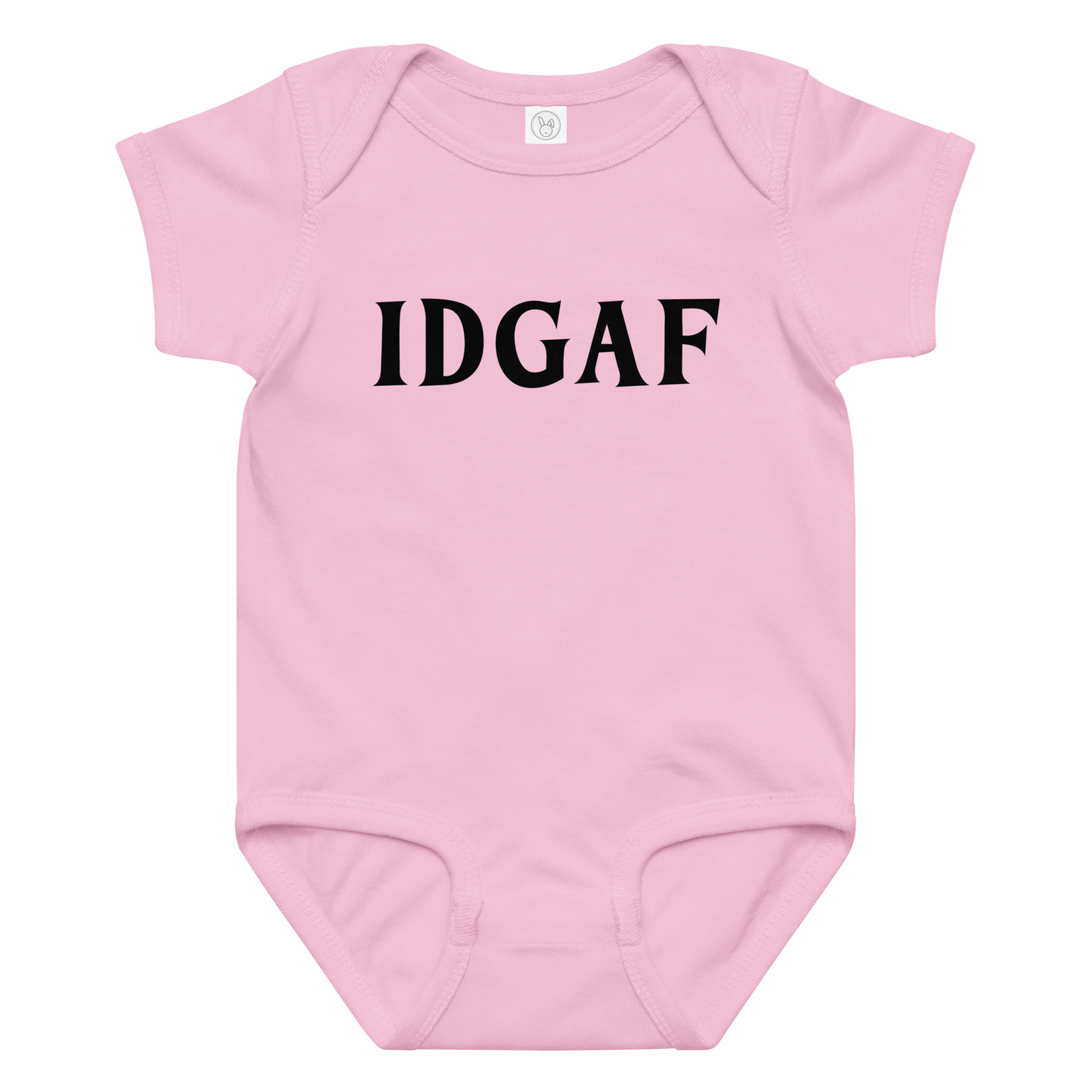 "IDGAF" printed on a pink baby jersey bodysuit laying on a flat surface amongst other clothes