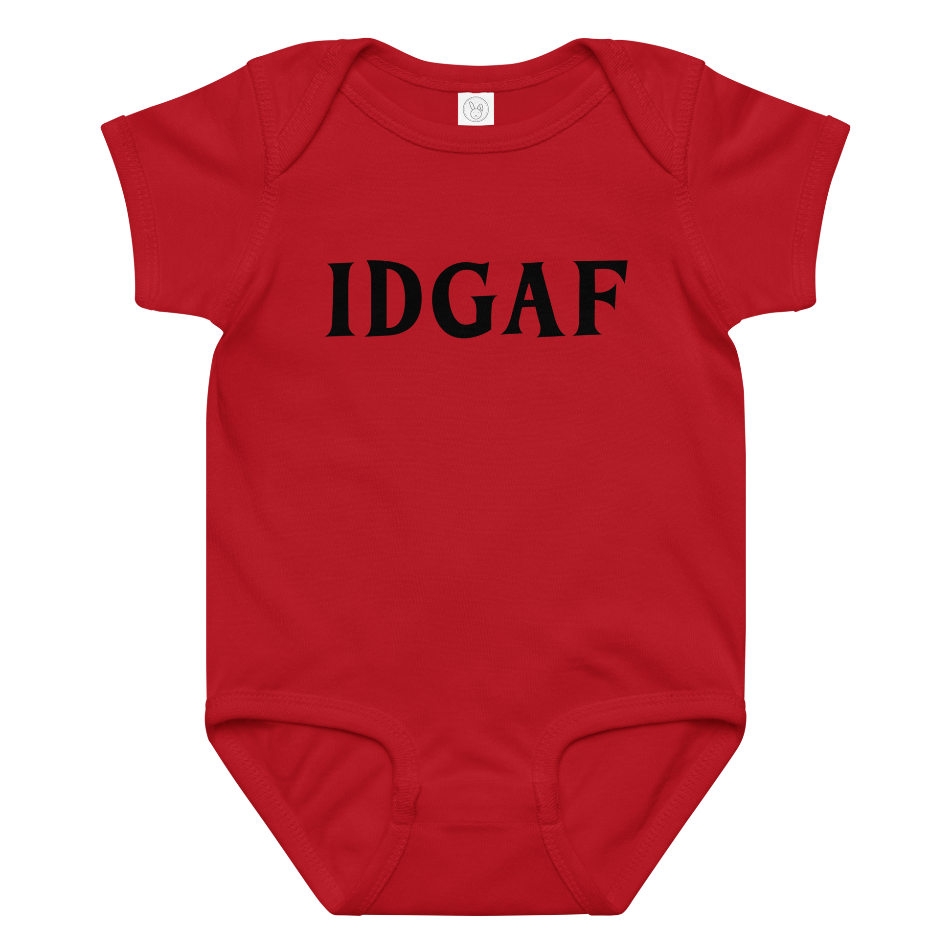 "IDGAF" printed on a red baby jersey bodysuit laying on a flat surface amongst other clothes