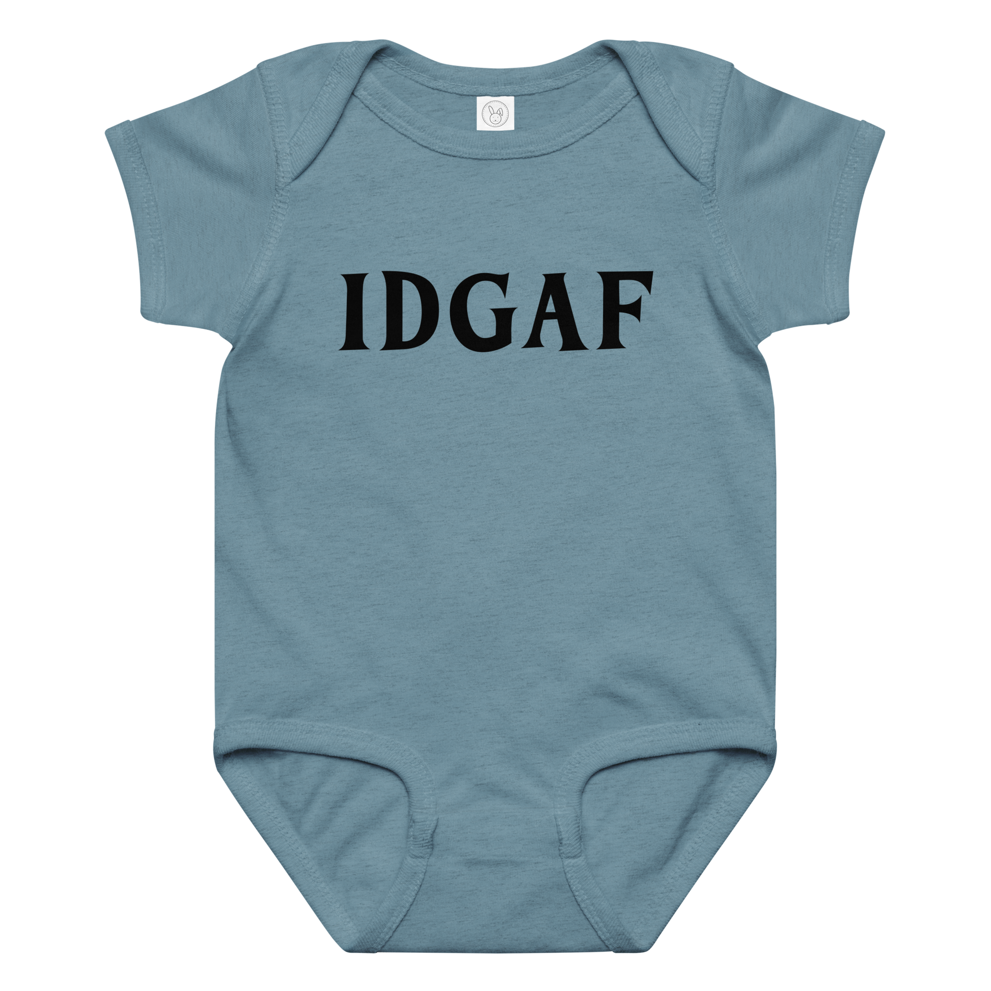 "IDGAF" printed on a vintage indigo baby jersey bodysuit laying on a flat surface amongst other clothes