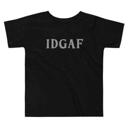 "IDGAF" printed on a black toddler short sleeve tee laying on a flat surface