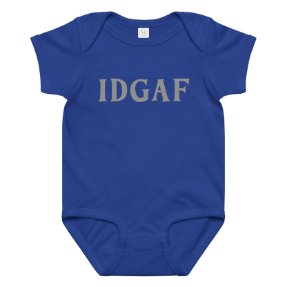 "IDGAF" printed on a royal baby jersey bodysuit laying on a flat surface amongst other clothes