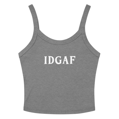 "IDGAF" printed on a athletic heather women's micro-rib tanktop laying on a flat surface amongst sunglasses and shorts