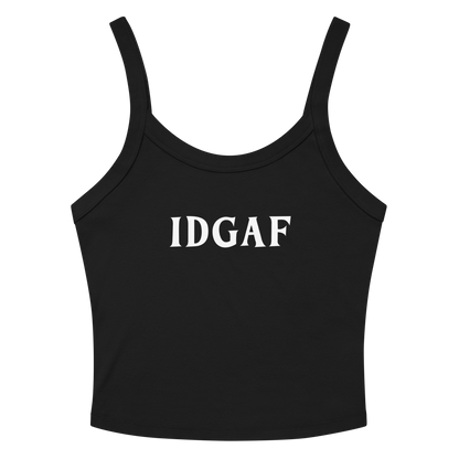 "IDGAF" printed on a solid black blend women's micro-rib tanktop laying on a flat surface amongst sunglasses and shorts