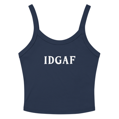 "IDGAF" printed on a solid navy blend women's micro-rib tanktop laying on a flat surface amongst sunglasses and shorts