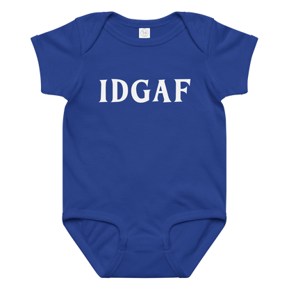 "IDGAF" printed on a royal baby jersey bodysuit laying on a flat surface amongst other clothes