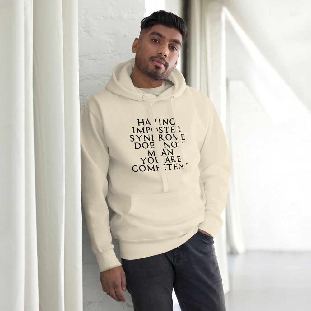 "Having Imposter Syndrome does not mean you are competent" printed on a bone unisex hoodie worn by a male
