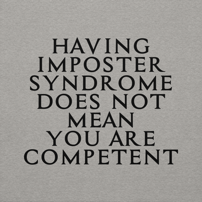 "Having Imposter Syndrome does not mean you are competent" printed on a carbon grey background