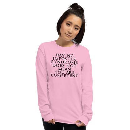 "Having Imposter Syndrome does not mean you are competent" printed on a light pink men's long sleeve shirt worn by a female