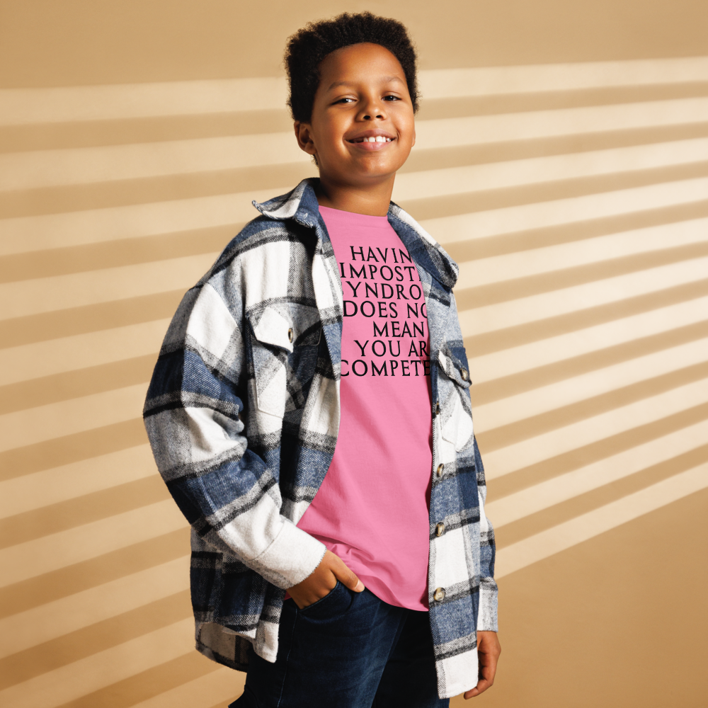 "Having Imposter Syndrome does not mean you are competent" printed on a azalea youth classic tee worn by a male also wearing a jacket