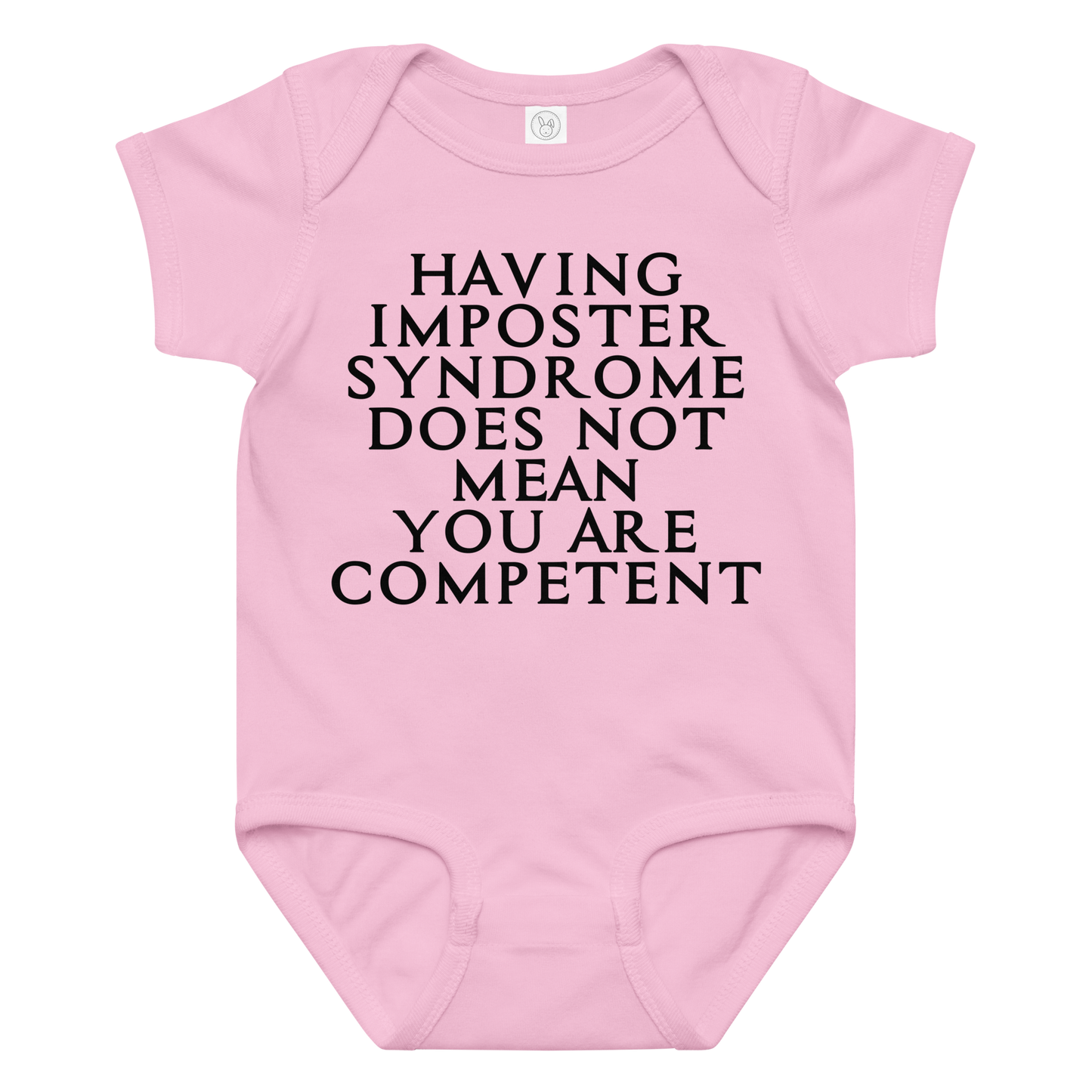 "Having Imposter Syndrome does not mean you are competent" printed on a pink baby jersey bodysuit laying on a flat surface amongst other clothes