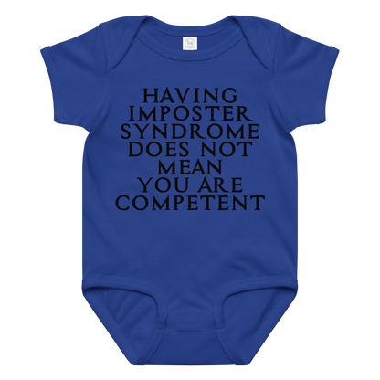 "Having Imposter Syndrome does not mean you are competent" printed on a royal baby jersey bodysuit laying on a flat surface amongst other clothes