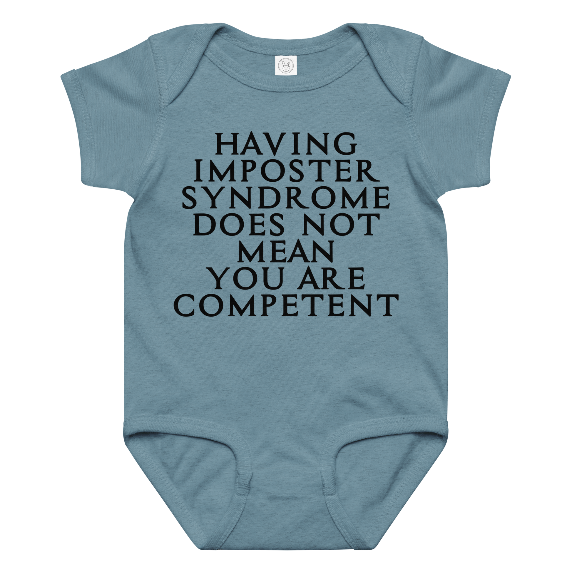 "Having Imposter Syndrome does not mean you are competent" printed on a vintage indigo baby jersey bodysuit laying on a flat surface amongst other clothes