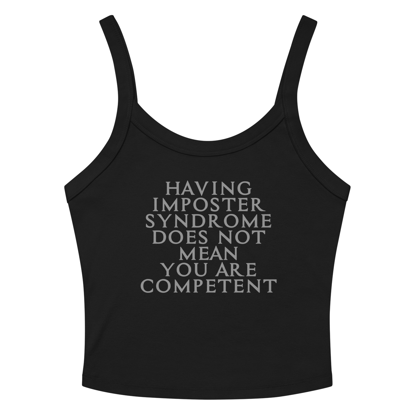 "Having Imposter Syndrome does not mean you are competent" printed on a solid black blend women's micro-rib tanktop laying on a flat surface amongst sunglasses and shorts