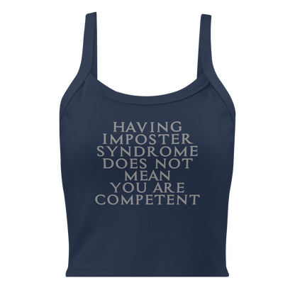 "Having Imposter Syndrome does not mean you are competent" printed on a solid navy blend women's micro-rib tanktop laying on a flat surface